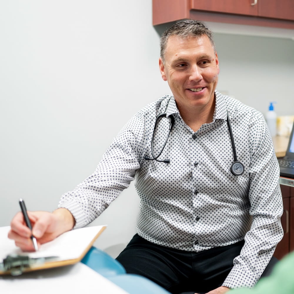 Dr. Vance Anderson speaking with patient.